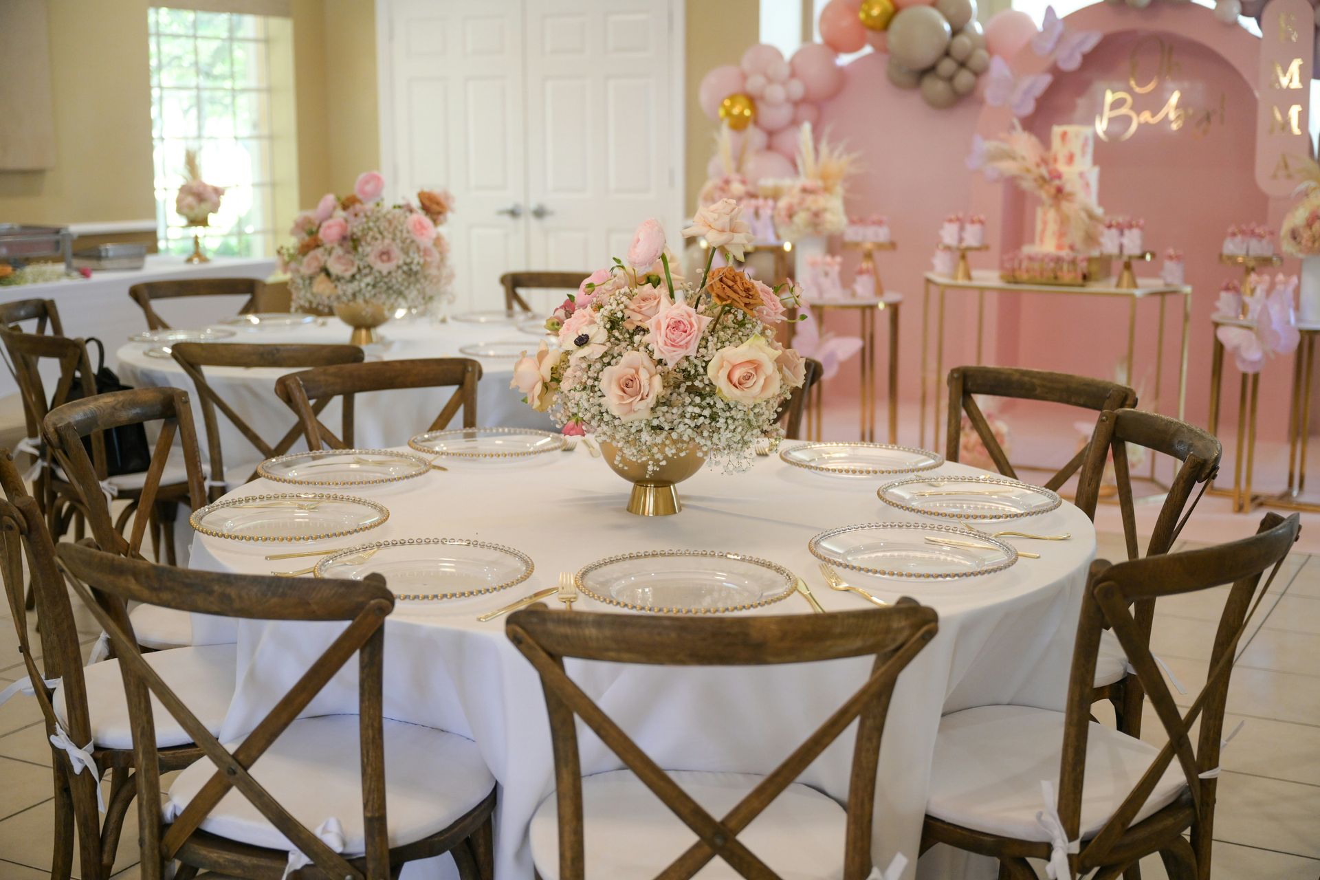 a table with a vase of flowers on top of it